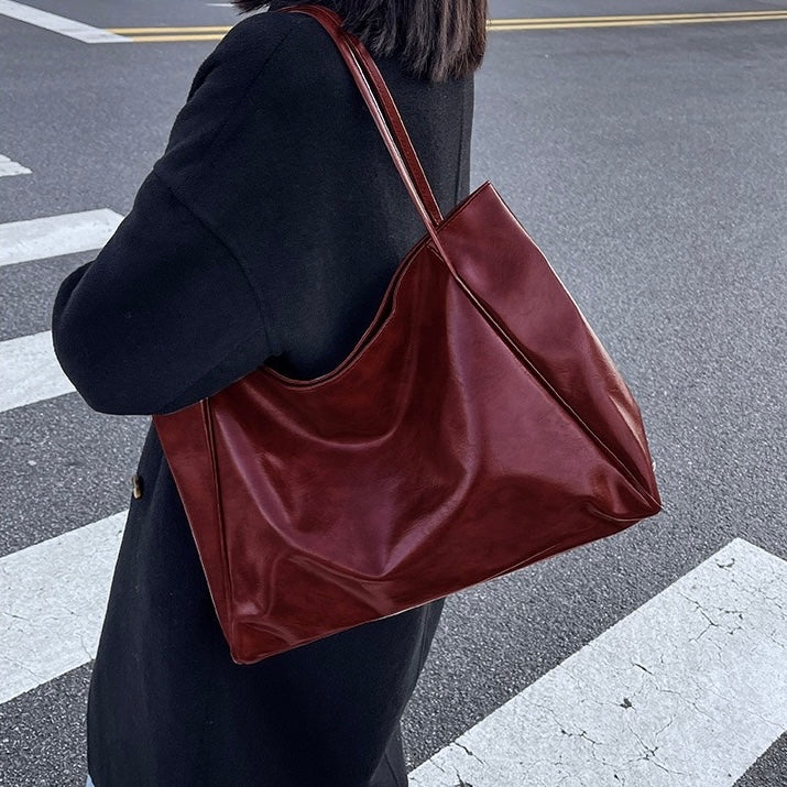 Paula | Glänzende Ledertasche